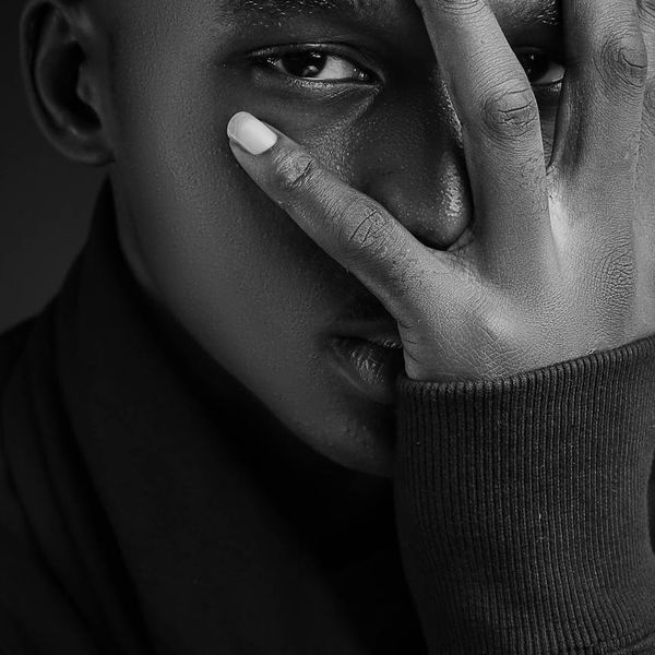 Confident man with a healthy posture looking directly at the camera.